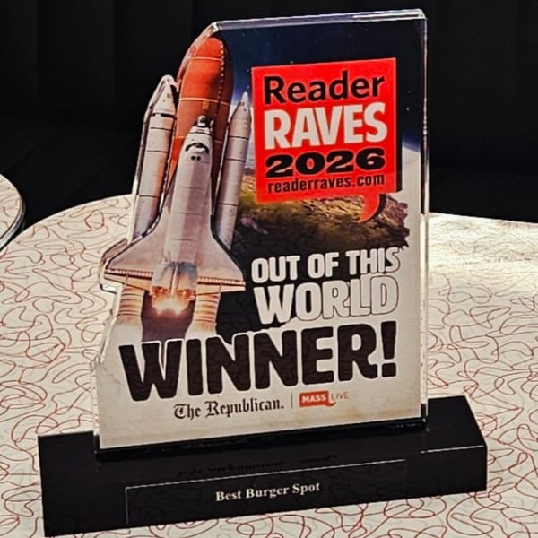 A "Reader Raves 2026 Winner! Best Burger Spot" award with a space shuttle graphic.